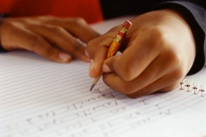 Schoolboy Writing with Chewed-Up Pencil Stub
