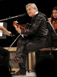 Brazilian musician Caetano Veloso plays the guitar while performing at the annual gala for The Museum of Contemporary Art, Los Angeles (MOCA), in Los Angeles