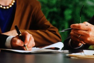 Executive signing a contract