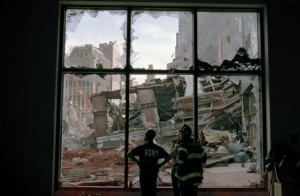 USA. New York City. September 17, 2001. Firefighters survey the wreckage of the World Trade Center through