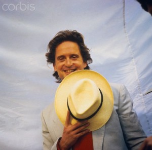 Michael Douglas Holding Hat to His Face