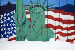 Snow Against Statue of Liberty Painted on Fence