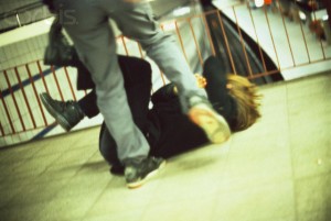 Man Kicking a Woman in Subway Station