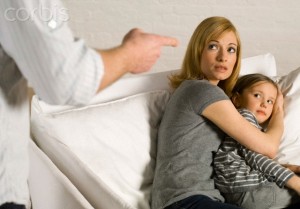 Mother protecting daughter from violent father