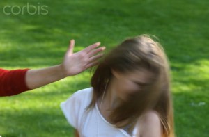 Woman slapping a child