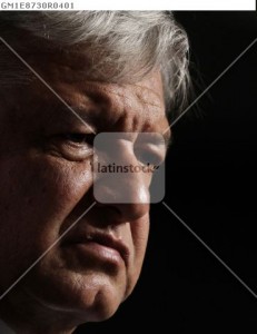 Lopez Obrador, presidential candidate for the Party of the Democratic Revolution, listens during a news conference with the media and supporters at a hotel in Mexico City