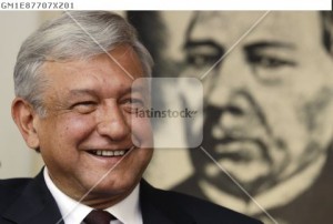 Lopez Obrador, presidential candidate for PRD, smiles during a news conference at his campaign headquarters in Mexico City