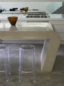 Bar stools at breakfast bar in kitchen in Australian home