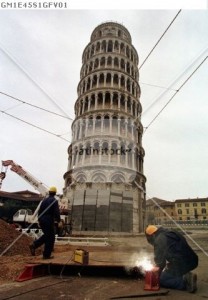 File photo of people working at the base of the leaning tower of Pisa