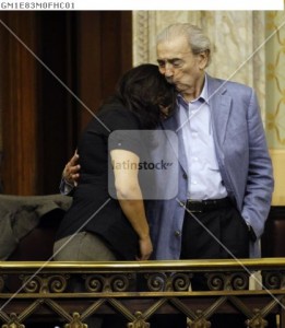 Gelman is comforted by her grandfather during a ceremony in which the Uruguayan state assumed responsibility for the kidnapping and the murder of her mother, in Montevideo