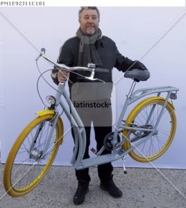 French designer Philippe Starck presents his "Pibal" public bicycle during a photocall at the Bordeaux city hall