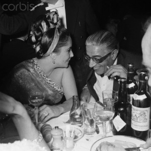 Liz Taylor Whispers to Aristotle Onassis