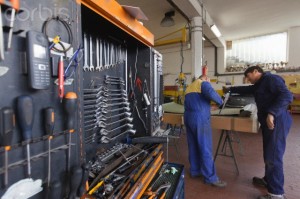 Mechanics working in garage
