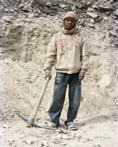 Indian Roadside Worker with Pickaxe