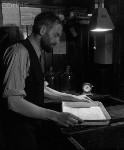 Working In My Darkroom, San Francisco, c. 1936 by Ansel Adams