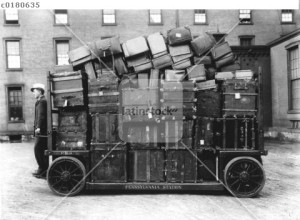 Luggage cart at train station, 1910s