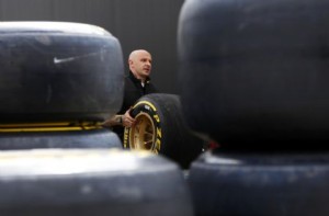 A Pirelli technician works on tires in the paddock while preparing for the British F1 Grand Prix at Silverstone