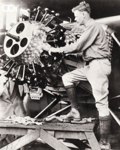 Charles Lindbergh Checking Plane Engine