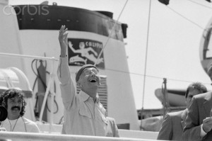 Jacques Cousteau Waving from Large Boat