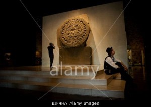 Tourists visit the National Museum of Anthropology,  near the Sun Stone, commonly known as the Aztec Calendar, in Mexico City
