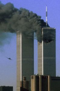Hijacked United Airlines Flight 175 flies toward the World Trade Center twin towers shortly before slamming into the south tower in New York