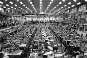 Tehran. Prison of Evin. Political prisoners in the tailoring department, singing islamic slogans.