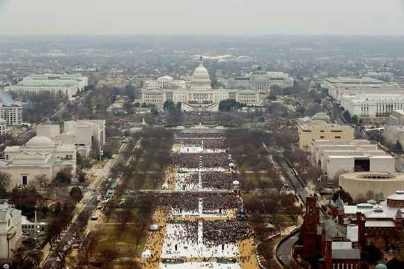 Attendees partake in the inauguration ceremonies to swear in Donald Trump as the 45th president of the United States at the U.S. Capitol in Washington, U.S., January 20, 2017. REUTERS/Lucas Jackson SEARCH "JACKSON VARIAS" FOR THIS STORY. SEARCH "WIDER IMAGE" FOR ALL STORIES. TPX IMAGES OF THE DAY