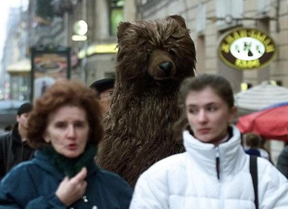 A men dressed in bear's fur advertises a newly opened restaurant Masha i Medved (Masha and the Bear) in the centre of St.Petersburg December 6, 2000. Some unusual and often aggressive advertising used by many newly created companies helps them to get customers' attention to their products. CVI