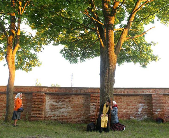 Belarussians attend confession in the garden of a catholic church during the Icon of Gods Mother festival in Belarussian village Budslav. Photo by Vasily Fedosenko