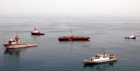 An undated recently taken British Ministry of Defence hand out photograph released on March 31, 2003 shows Royal Naval vessels continuing the recovery operation of the two 849 Naval Air Squadron Sea King Mark 7 helicopters which crashed on March 22, 2003 in the Gulf. Seven crew members including one American were killed in the crash when the two helicopters collided about five miles off Britain's HMS Ark Royal. EDITORIAL USE ONLY REUTERS/Jim Gibson/HO MD