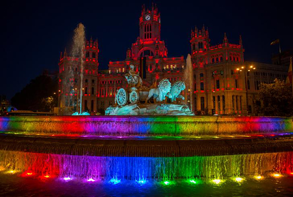 The Cibeles fountain is seen with rainbow colours projected on it during World Pride in Madrid, Spain, June 26, 2017. REUTERS/Juan Medina