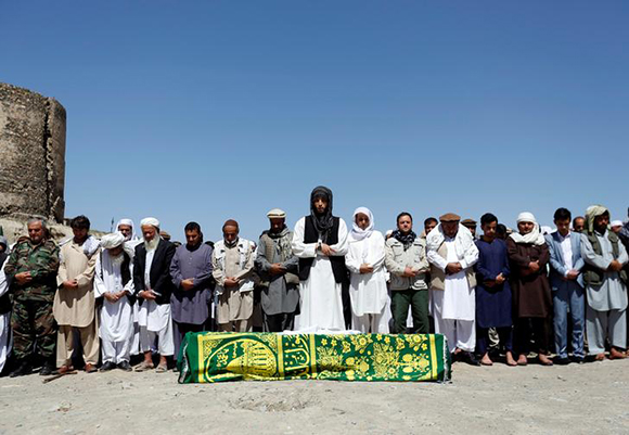 People perform prayers for one of the victims of Wednesday's blast during a burial ceremony in Kabul, Afghanistan June 1, 2017. REUTERS/Mohammad Ismail TPX IMAGES OF THE DAY