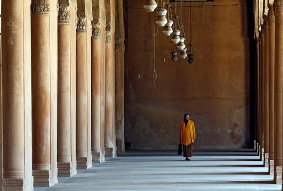 A woman walks at Ibn Tulun Mosque on the first Friday of the holy month of Ramadan in old Cairo, Egypt June 2, 2017. REUTERS/Amr Abdallah Dalsh
