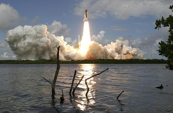 The space shuttle Discovery lifts off from Launch Pad 39A at the Kennedy Space Center in Cape Canaveral, Florida. Photo by Pierre Ducharme