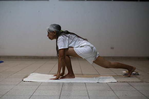 Yoga instructor Lidia Paz teaches a class at the Universal Great Brotherhood "Serge Raynaud de la Ferriere" in San Salvador, El Salvador. Photo by Jose Cabezas