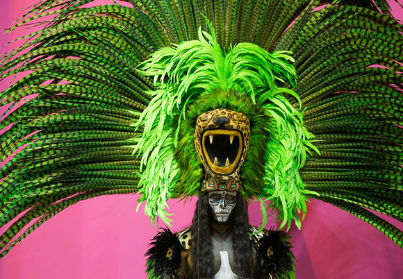 A dancer promoting a hotel in Mexico poses at a tourism booth during the first day of the International Tourism Trade Fair (FITUR) in Madrid, Spain. Photo by Paul Hanna