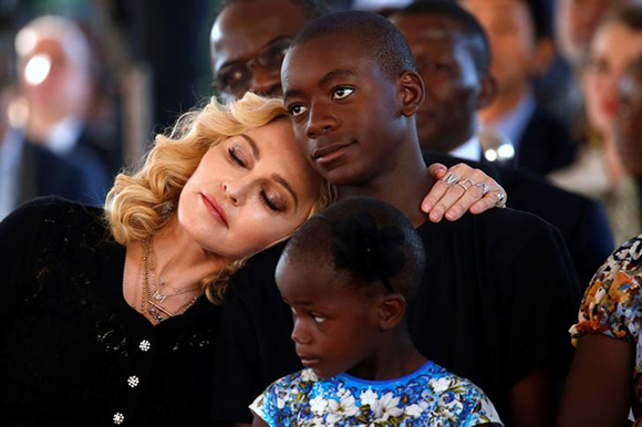 US singer Madonna embraces her son, David Banda ahead of the opening of the Mercy James hospital in Blantyre, Malawi, July 11,2017. Photo by Siphiwe Sibeko