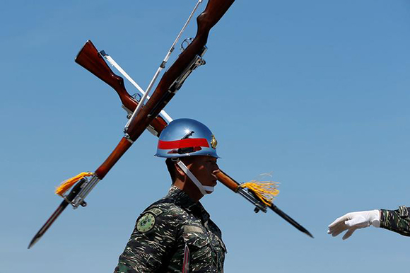 Honour guards perform during military drill at navy base in Kaohsiung, Taiwan July 13, 2017. Photo by Tyrone Siu