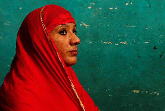  Bouncer Mehrunnisha Shokat Ali offers her evening prayer during holy month of Ramadan at her house in New Delhi, India, May 31, 2017. Photo by Adnan Abidi
