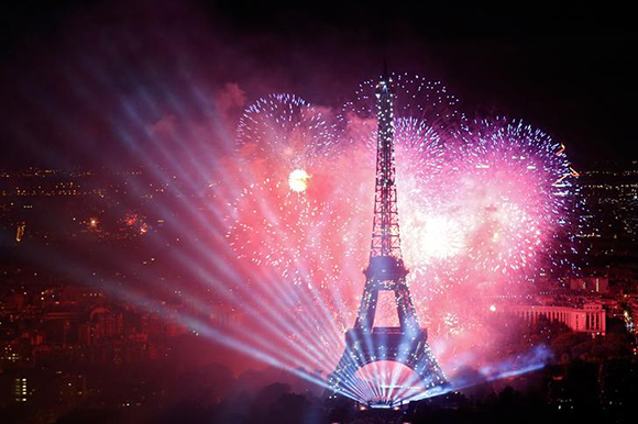  Fireworks explode in the sky above the Eiffel Tower, in a picture taken from the Montparnasse Tower Observation Deck. Photo by Pascal Rossignol