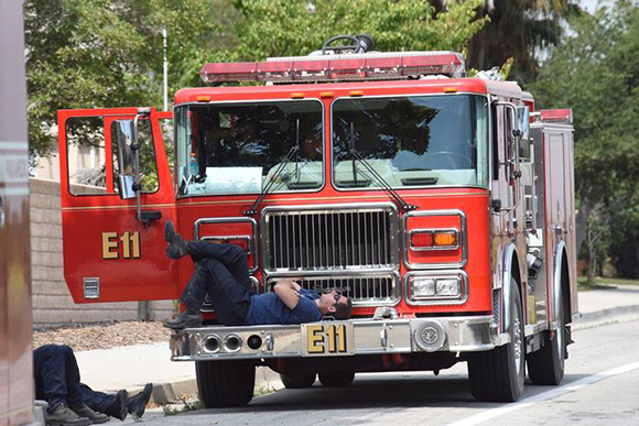 Firefighters from a Burbank engine company take a break after working all night tackling the Whittier Fire near Santa Barbara, California, U.S. Photo by Mike Eliason