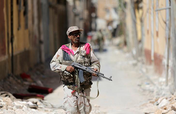  A member of the Libyan Army's special forces holds his weapon during clashes with Islamist militants in the militants' last stronghold in Benghazi, Libya, July 17, 2017. Photo by Esam Omran Al-Fetori