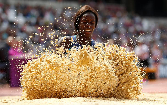  Athletics - IAAF World ParaAthletics Championships - London, Britain - July 23, 2017 Sand flies up as France's Angelina Lanza takes part in the Women's Long Jump T47 Final Photo by Peter Cziborra