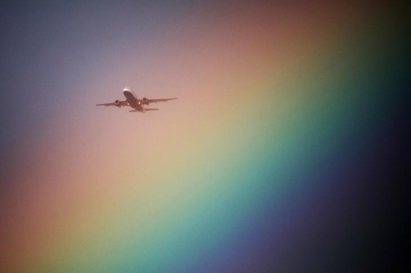  A British Airways aeroplane flies near a rainbow on its way to Heathrow Airport in London, Britain. Photo by Kevin Coombs 
