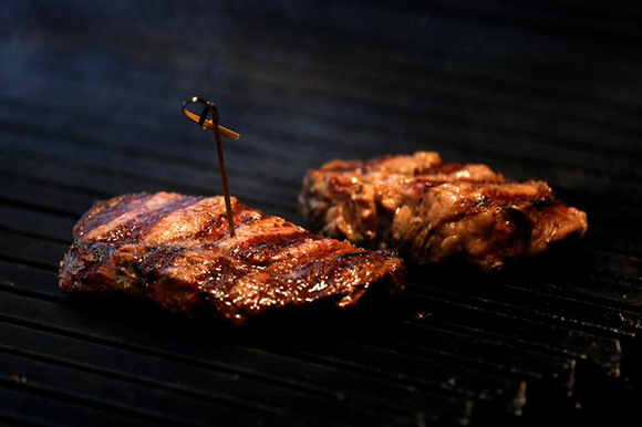  Meat is grilled at the Cabana Argentina restaurant in Madrid, Spain. Photo by Juan Medina Photo by Edgard Garrido 