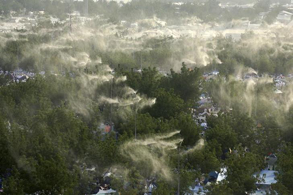  Water is sprayed over pilgrims tents whilst pilgrims perform Wuquf at Jabal al-Rahmanat Jabal, the Mount of Mercy, at the center of the plain of Arafat, near Mecca. Photo by Ali Jarekji