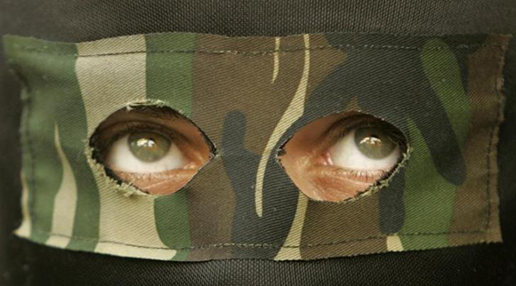  A Palestinian Hamas militant attends the funeral of Naim Al-Aroki in Gaza. Photo by Mohammed Salem