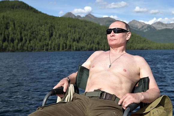 Russian President Vladimir Putin relaxes after fishing during the hunting and fishing trip which took place on August 1-3 in the republic of Tyva in southern Siberia, Russia, in this photo released by the Kremlin on August 5, 2017. Photo by Sputnik/Alexei Nikolsky/Kremlin