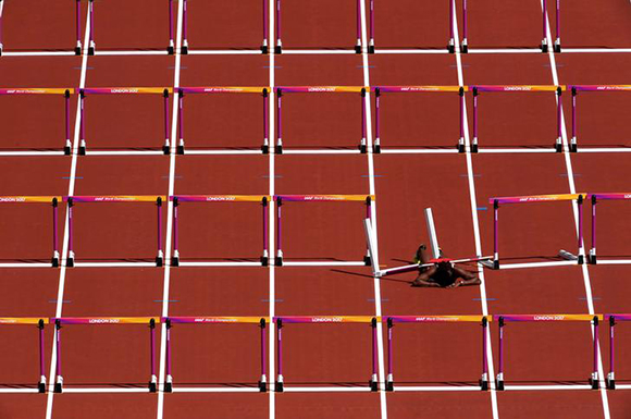 Athletics - World Athletics Championships - Women's 100 Metres Hurdles Heats - London Stadium, London, Britain – August 11, 2017. Deborah John of Trinidad and Tobago after falling during the heats. Photo by Toby Melville