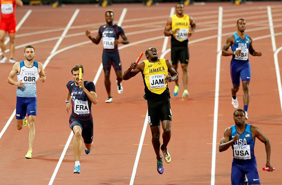 Athletics - World Athletics Championships - Men's 400 Metres Relay Final - London Stadium, London, Britain – August 12, 2017. Usain Bolt of Jamaica appears injured during the final. Photo by John Sibley